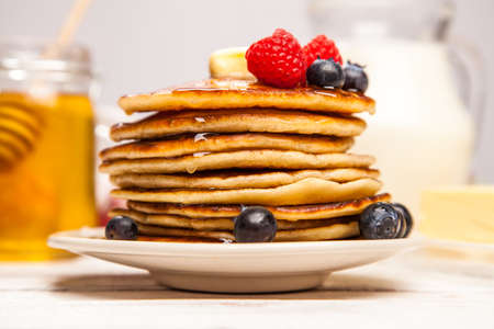 High pile of delicious pancakes with blueberry