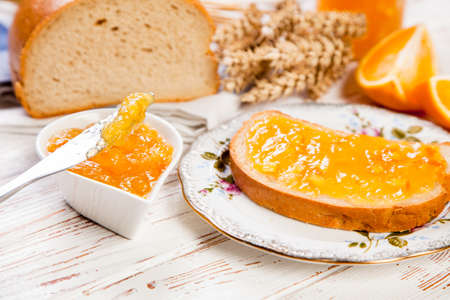 Slices of bread with jam for breakfastの写真素材