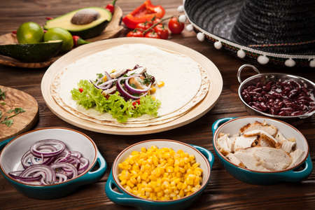 Traditional mexican tortilla with a mix of ingredientsの写真素材