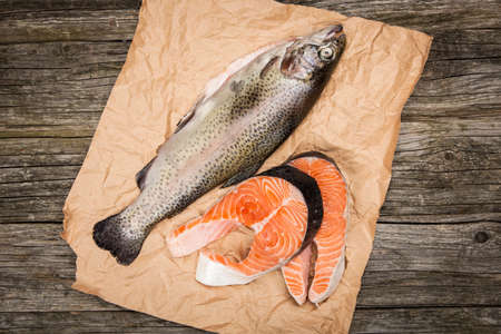 Fresh salmon slice on old woodの写真素材