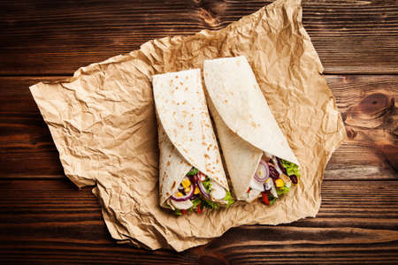 Traditional mexican tortilla wrap with a mix of ingredients