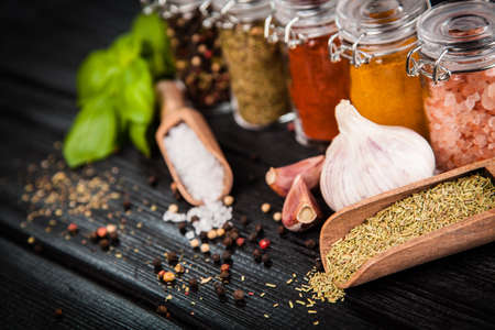 Set of different herbs and spice on dark backgroundの写真素材