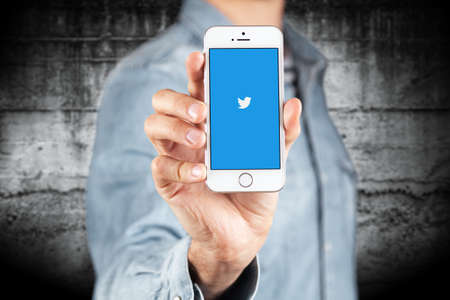 WROCLAW, POLAND - APRIL 12, 2016: Apple iPhone SE smartphone with Twitter app on screenのeditorial素材