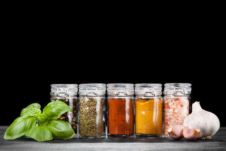 Set of different herbs and spice on dark backgroundの写真素材