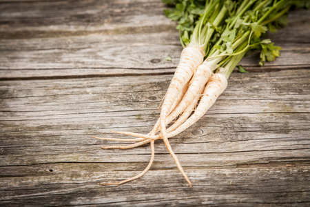 Fresh organic vegetables on wooden surfaceの写真素材