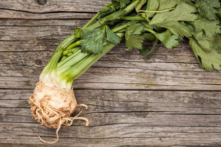 Fresh organic vegetables on wooden surface