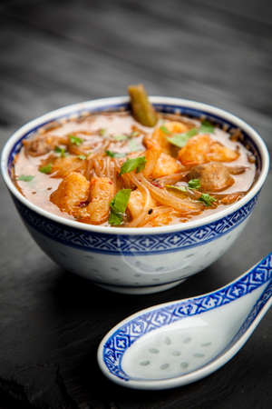 Traditional asian shrimp soup in a bowlの写真素材