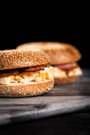 Bagel with bacon and egg for breakfastの写真素材