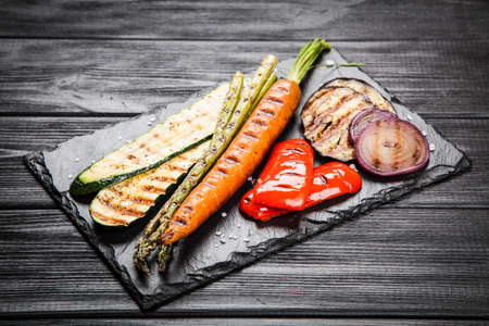 Assortment of grilled vegetables on dark background
