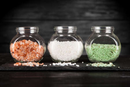 Different types of cooking salt on black backgroundの写真素材