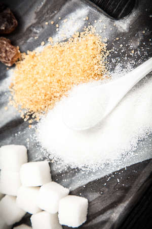 Different types of sugar on black 
backgroundの写真素材