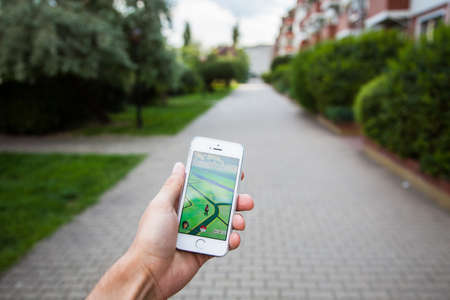 WROCLAW, POLAND - JULY 31, 2016: Popular augmented reality game Pokemon Go on the screen of Apple iPhone 5s smartphoneのeditorial素材