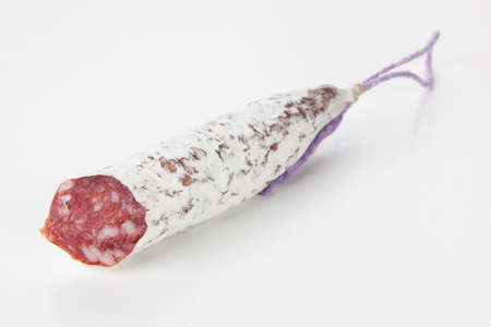 Traditional italian salami on white backgroundの写真素材