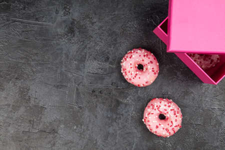 DIfferent tasty donuts on dark backgroundの写真素材