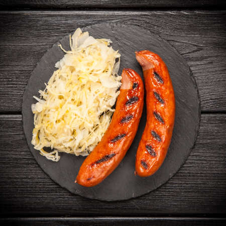Traditional german food of sauerkraut and bratwurstの写真素材
