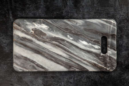Marble cutting board on black backgroundの写真素材