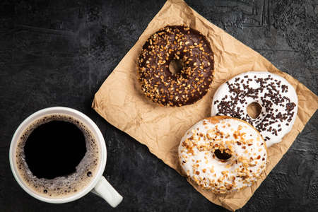 DIfferent tasty donuts on dark backgroundの写真素材