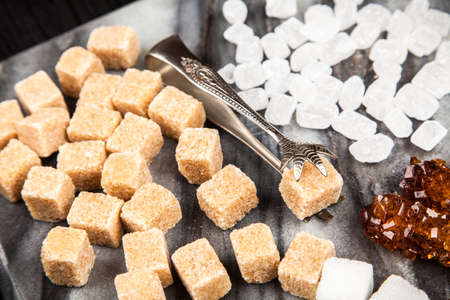 Different types of sugar on black backoundの写真素材