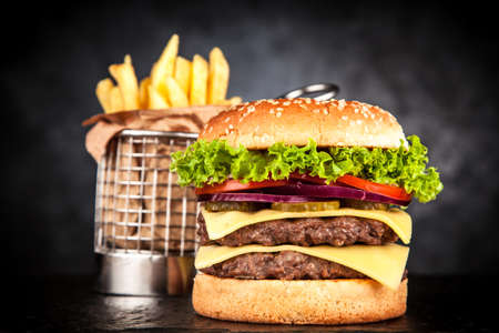 Delicious grilled burger on black backgroundの写真素材