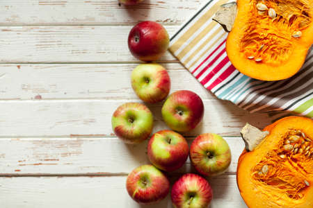 Fresh juicy apples on white wood backgroundの写真素材