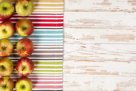 Fresh juicy apples on white wood backgroundの写真素材