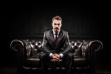 Young confident businessman in a suitの写真素材