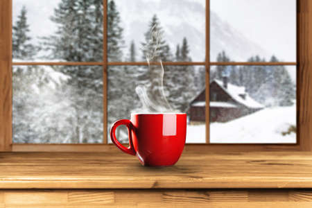 Cup of hot coffee on a cold winter dayの写真素材