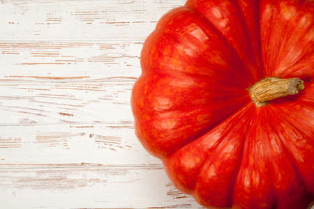 Large pumpkin on white wood backgroundの写真素材