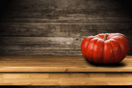 Large pumpkin on dark wooden backgroundの写真素材