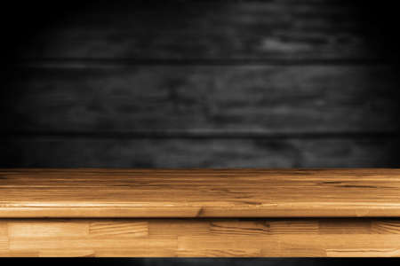Wooden table on black backgroundの写真素材
