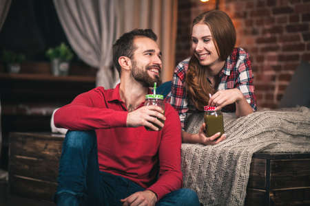 Young couple in their loft style apartmentの写真素材