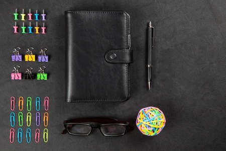 Office supplies on leather surface tableの写真素材