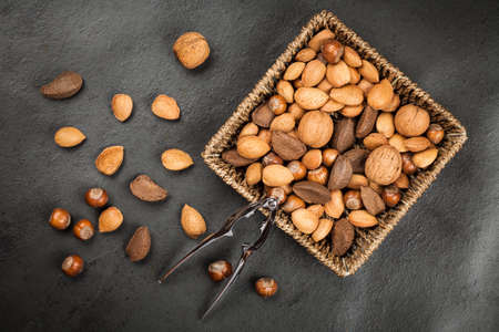 Assortment of nuts on dark slate background
