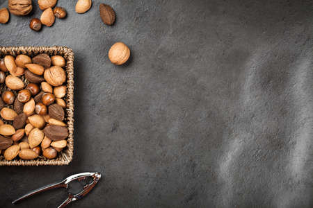 Assortment of nuts on dark slate backgroundの写真素材