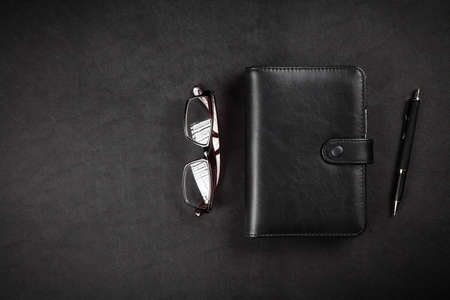 Organizer on leather surface tableの写真素材