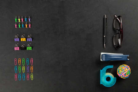 Office supplies on a black tableの写真素材