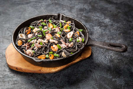 Black spaghetti with seafoodの写真素材