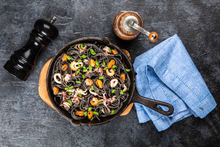 Black spaghetti with seafoodの写真素材