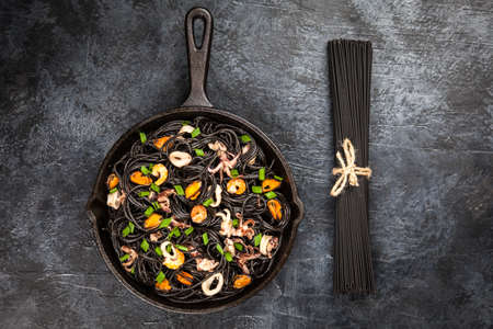 Black spaghetti with seafoodの写真素材