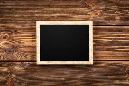 Picture frame on a wooden wallの写真素材