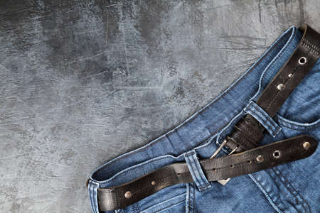 Blue jeans on dark backgroundの写真素材