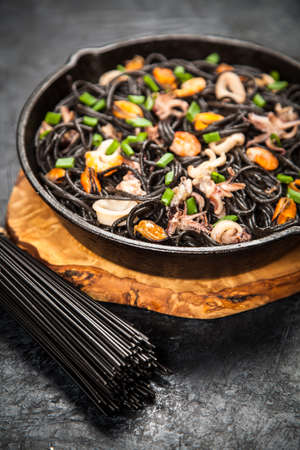 Black spaghetti with seafoodの写真素材