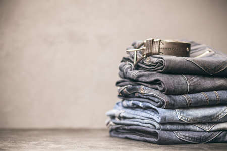 Jeans arranged in a stackの写真素材