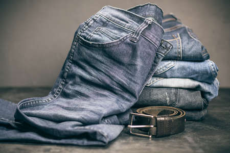 Jeans arranged in a stackの写真素材
