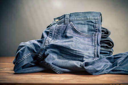 Jeans arranged in a stackの写真素材