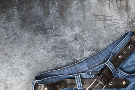 Blue jeans on dark backgroundの写真素材