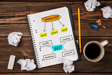 Open notepad with seo and marketing sketchの写真素材