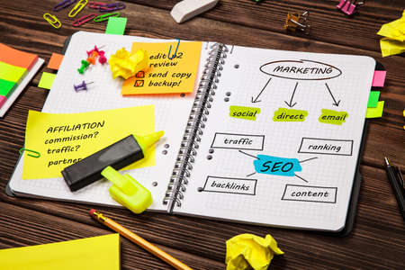 Open notepad with seo and marketing sketch