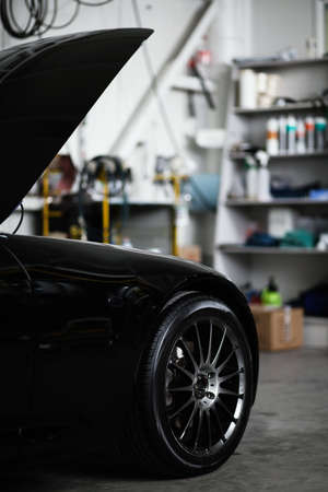 Sports car in a workshopの写真素材