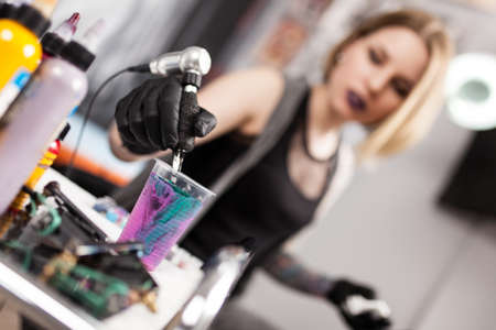 Tattoo artist in a studioの写真素材